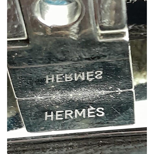 67 - An Hermes 'Victoria' Luggage Bag. Textile and leather exterior with silver-toned hardware, 5 protect... 