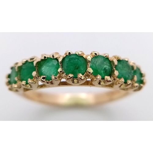 705 - A 9K YELLOW GOLD EMERALD SET BAND RING 2.3G SIZE O

SC 4058