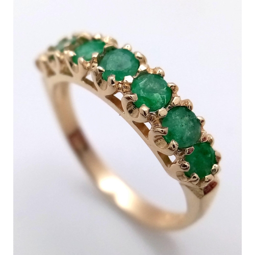 705 - A 9K YELLOW GOLD EMERALD SET BAND RING 2.3G SIZE O

SC 4058