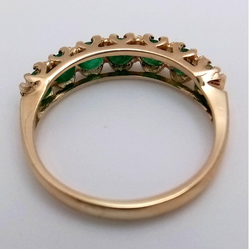 705 - A 9K YELLOW GOLD EMERALD SET BAND RING 2.3G SIZE O

SC 4058