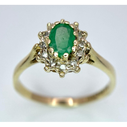 796 - A 9K GOLD EMERALD AND DIAMOND CLUSTER RING .  1.8gms   size M