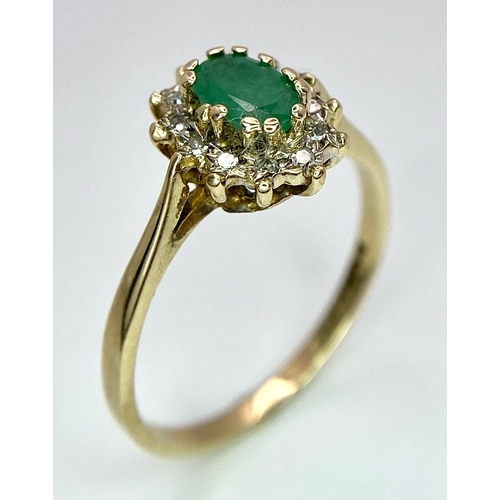 796 - A 9K GOLD EMERALD AND DIAMOND CLUSTER RING .  1.8gms   size M