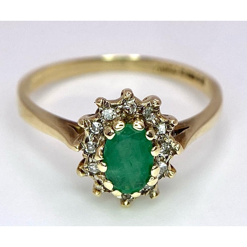 796 - A 9K GOLD EMERALD AND DIAMOND CLUSTER RING .  1.8gms   size M