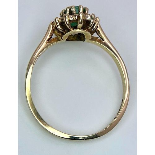 796 - A 9K GOLD EMERALD AND DIAMOND CLUSTER RING .  1.8gms   size M