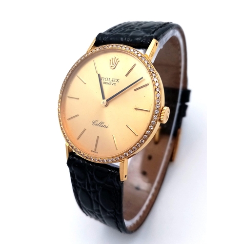 1018 - A Vintage 18K Gold and Diamond Cased Rolex Cellini Gents Watch. Black leather strap. 18k gold and di... 