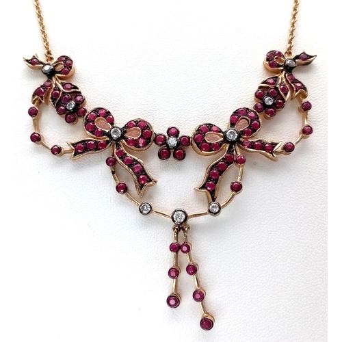 1208 - An Art Deco Style 9K Yellow Gold Ruby and Diamond Lavaliere Necklace. Floral and bow decoration. 40c... 