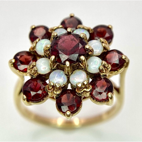 1044 - A GARNET AND OPAL CLUSTER RING SET IN 9K GOLD .2.7gms   size P