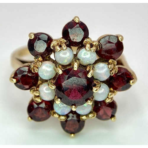 1044 - A GARNET AND OPAL CLUSTER RING SET IN 9K GOLD .2.7gms   size P