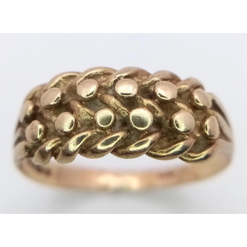 1235 - A Vintage 9K Yellow Gold Keeper Ring. Size R. 2.9g weight.