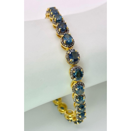 731 - A Kyanite Tennis Bracelet with Diamond Accents on Gilded 925 Silver. Approximately 8ctw kyanites, 3.... 