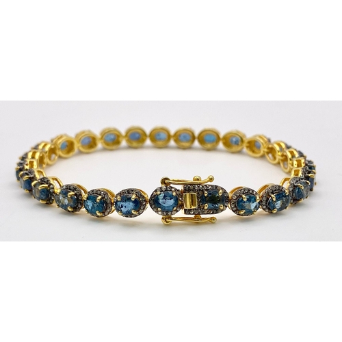 731 - A Kyanite Tennis Bracelet with Diamond Accents on Gilded 925 Silver. Approximately 8ctw kyanites, 3.... 