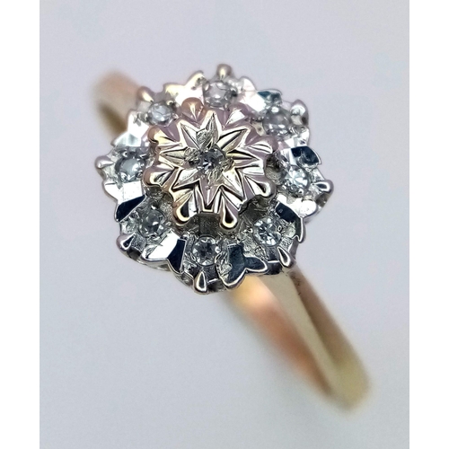 817 - A 9K GOLD DIAMOND CLUSTER RING  .    1.5gms   size M