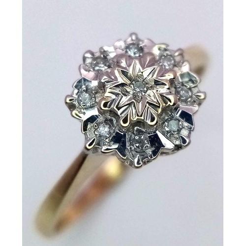 817 - A 9K GOLD DIAMOND CLUSTER RING  .    1.5gms   size M