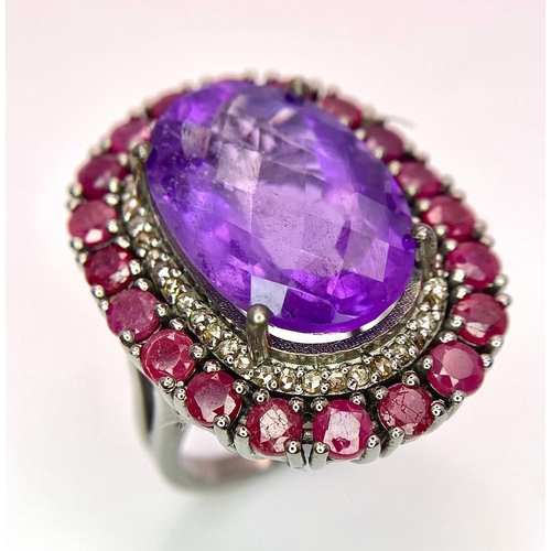 822 - An Amethyst Ring with a Ruby and Diamond Surround on 925 Silver. 4.2ctw rubies, 0.50ctw diamonds. Si... 