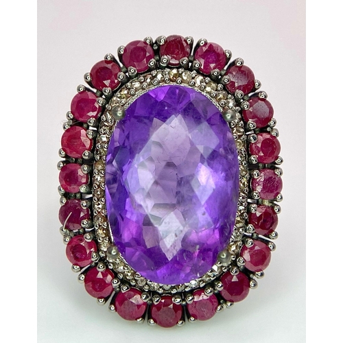 822 - An Amethyst Ring with a Ruby and Diamond Surround on 925 Silver. 4.2ctw rubies, 0.50ctw diamonds. Si... 