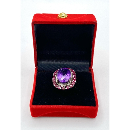 822 - An Amethyst Ring with a Ruby and Diamond Surround on 925 Silver. 4.2ctw rubies, 0.50ctw diamonds. Si... 