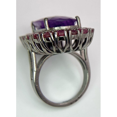 822 - An Amethyst Ring with a Ruby and Diamond Surround on 925 Silver. 4.2ctw rubies, 0.50ctw diamonds. Si... 