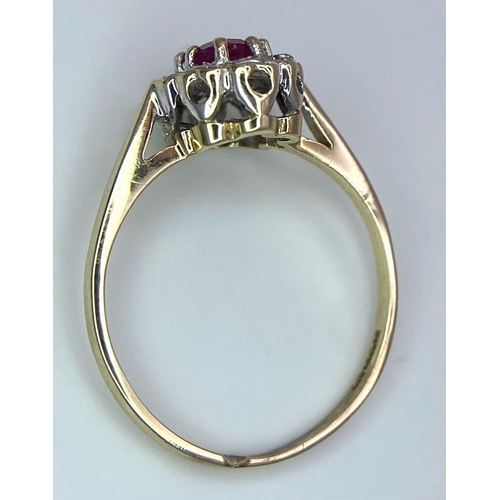 824 - A 9K GOLD DIAMOND AND RUBY CLUSTER RING .   1.8gms    size M