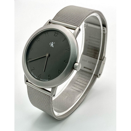 954 - A CK CALVIN KLEIN WATCH FULL WORKING ORDER WITH ORIGINAL BOX AND PAPERS 

H 4001