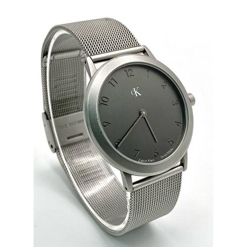 954 - A CK CALVIN KLEIN WATCH FULL WORKING ORDER WITH ORIGINAL BOX AND PAPERS 

H 4001