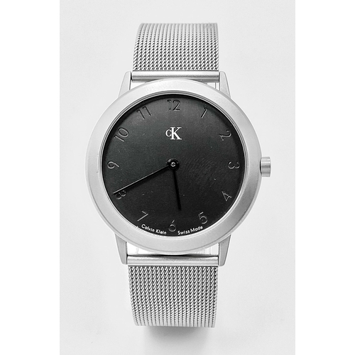 954 - A CK CALVIN KLEIN WATCH FULL WORKING ORDER WITH ORIGINAL BOX AND PAPERS 

H 4001