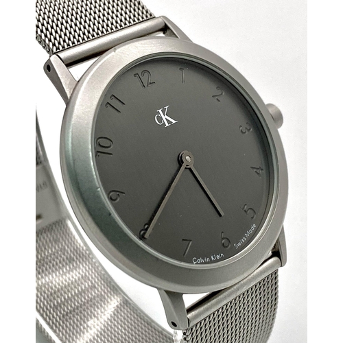 954 - A CK CALVIN KLEIN WATCH FULL WORKING ORDER WITH ORIGINAL BOX AND PAPERS 

H 4001