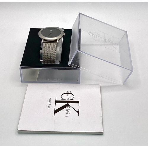 954 - A CK CALVIN KLEIN WATCH FULL WORKING ORDER WITH ORIGINAL BOX AND PAPERS 

H 4001