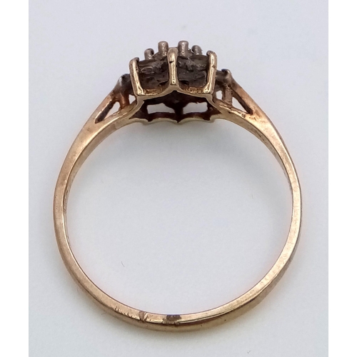 997 - a fancy 9K yellow gold Diamond floral cluster ring. Total weight 1.35G. Size K/L.  Approx 0.30ct dia... 