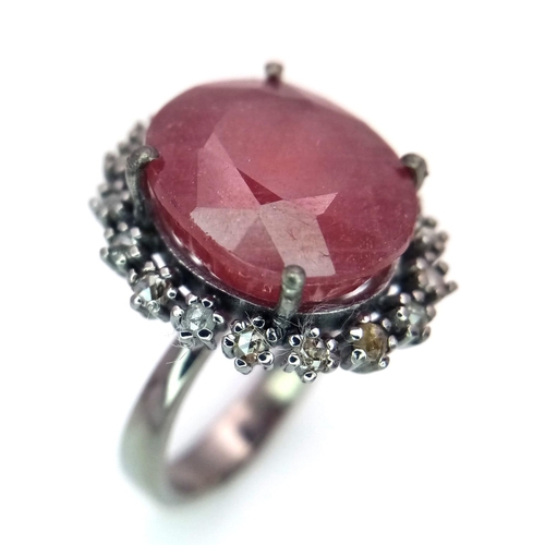 1088 - A Ruby Ring with a Halo of Diamonds on 925 Silver. 12.65ct ruby, 0.50ctw diamonds. Size P, 7.21g tot... 