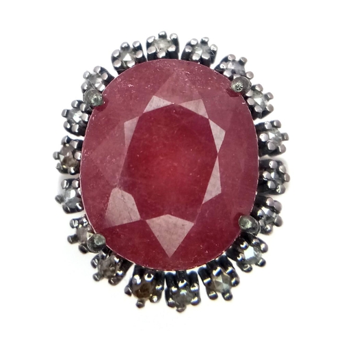 1088 - A Ruby Ring with a Halo of Diamonds on 925 Silver. 12.65ct ruby, 0.50ctw diamonds. Size P, 7.21g tot... 