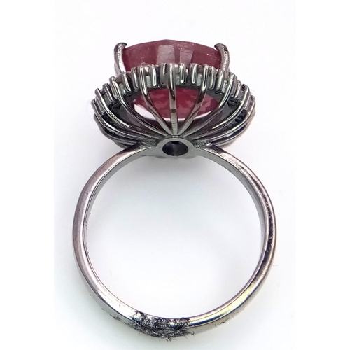 1088 - A Ruby Ring with a Halo of Diamonds on 925 Silver. 12.65ct ruby, 0.50ctw diamonds. Size P, 7.21g tot... 