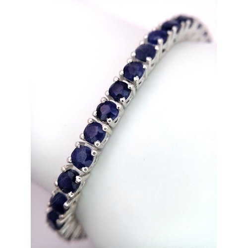 1102 - A Blue Sapphire Tennis Bracelet on 925 Silver. 19.5cm length, 0.4cm sapphires, 16.79g total weight. ... 