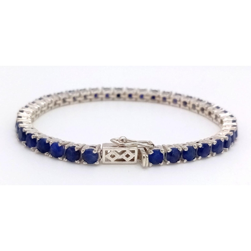 1102 - A Blue Sapphire Tennis Bracelet on 925 Silver. 19.5cm length, 0.4cm sapphires, 16.79g total weight. ... 