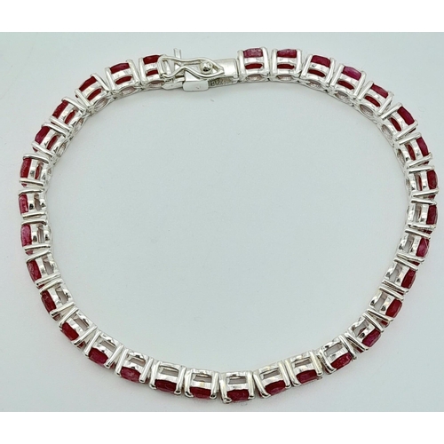 1109 - A Ruby Tennis Bracelet on 925 Silver. 19cm length, 0.5cm rubies, 17g total weight.    Ref: CD-1191