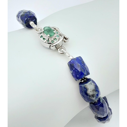 1116 - A Lapis Lazuli Bracelet with Emerald and 925 Silver Clasp. 110ctw. 20.5cm length, 22.57g total weigh... 