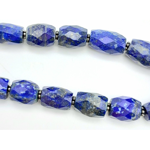 1116 - A Lapis Lazuli Bracelet with Emerald and 925 Silver Clasp. 110ctw. 20.5cm length, 22.57g total weigh... 