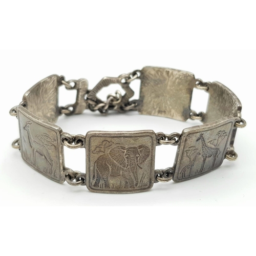 1177 - A vintage 925 silver African Safari animal motif square panels design with T-bar link bracelet. Tota... 