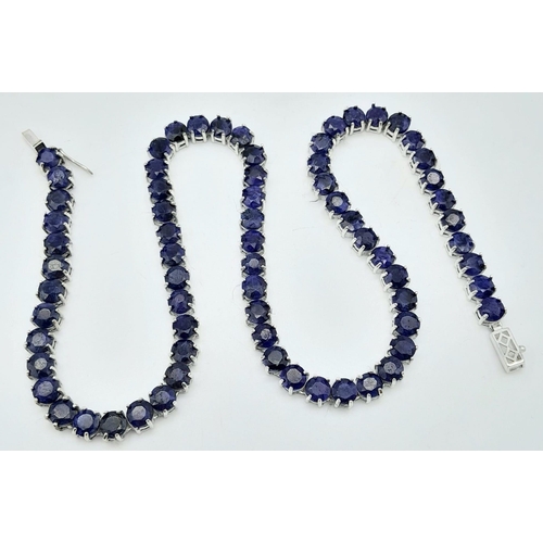 1209 - A Blue Sapphire Tennis Necklace on 925 Silver. 46.5cm length, 0.6cm sapphires, 49.4g total weight.  ... 