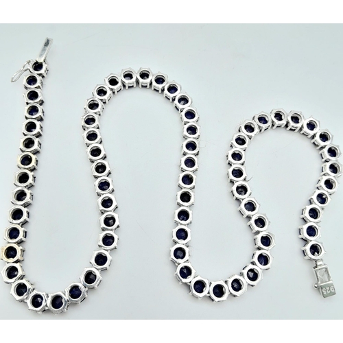 1209 - A Blue Sapphire Tennis Necklace on 925 Silver. 46.5cm length, 0.6cm sapphires, 49.4g total weight.  ... 