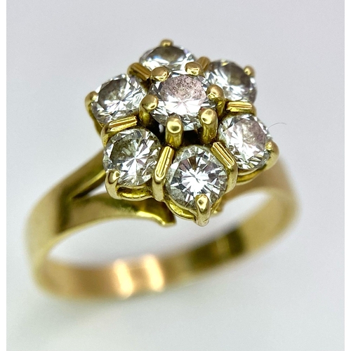 610 - A Gorgeous 18K Yellow Gold Diamond Floral Ring. Seven brilliant round cut diamonds create the perfec... 