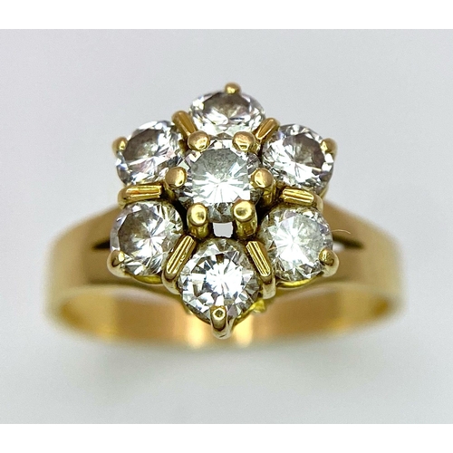 610 - A Gorgeous 18K Yellow Gold Diamond Floral Ring. Seven brilliant round cut diamonds create the perfec... 