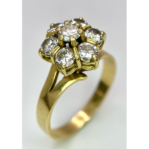 610 - A Gorgeous 18K Yellow Gold Diamond Floral Ring. Seven brilliant round cut diamonds create the perfec... 