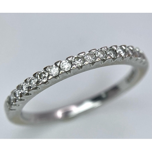 645 - A 18K WHITE GOLD DIAMOND BAND RING 0.15CT 2G SIZE J

A/S 1001