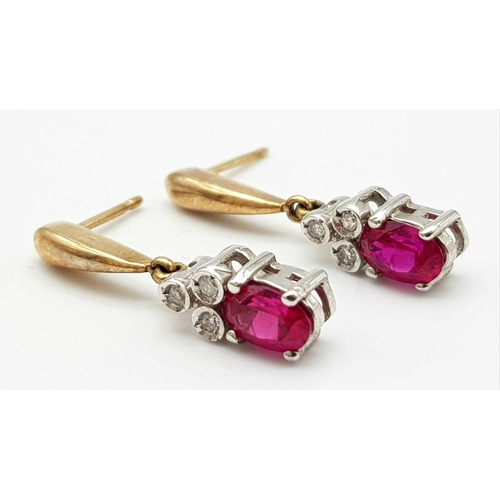 646 - A 9K YELLOW GOLD DIAMOND & RED STONE DROP EARRINGS BELIEVED TO BE RUBY 2.3G 22mm drop.

A/S 1025