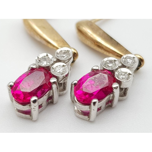 646 - A 9K YELLOW GOLD DIAMOND & RED STONE DROP EARRINGS BELIEVED TO BE RUBY 2.3G 22mm drop.

A/S 1025