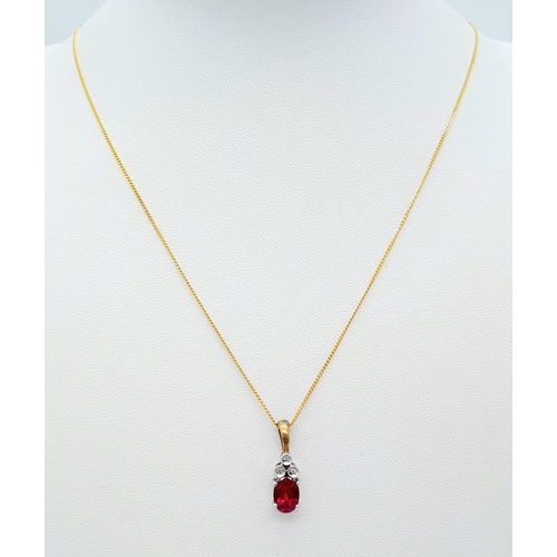 666 - A 9K YELLOW GOLD DIAMOND & RED STONE PENDANT BELIEVED TO BE RUBY & 9K GOLD CHAIN 2.8G , 46cm length.... 