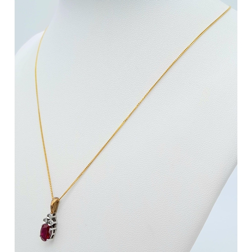 666 - A 9K YELLOW GOLD DIAMOND & RED STONE PENDANT BELIEVED TO BE RUBY & 9K GOLD CHAIN 2.8G , 46cm length.... 