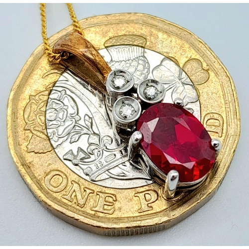 666 - A 9K YELLOW GOLD DIAMOND & RED STONE PENDANT BELIEVED TO BE RUBY & 9K GOLD CHAIN 2.8G , 46cm length.... 