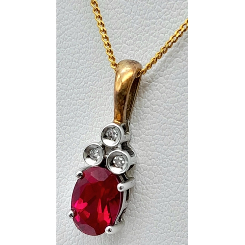 666 - A 9K YELLOW GOLD DIAMOND & RED STONE PENDANT BELIEVED TO BE RUBY & 9K GOLD CHAIN 2.8G , 46cm length.... 