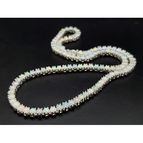 893 - An Opal Tennis Necklace on 925 Silver. 46.5cm length, 30.96g total weight.    Ref: CD-1194